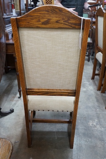 A set of six 18th century style oak dining chairs, with cream upholstered seats and backs